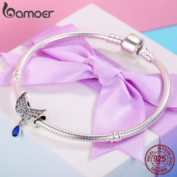 6c60607ac3f75ea03531730f Berloque Asas de Anjo