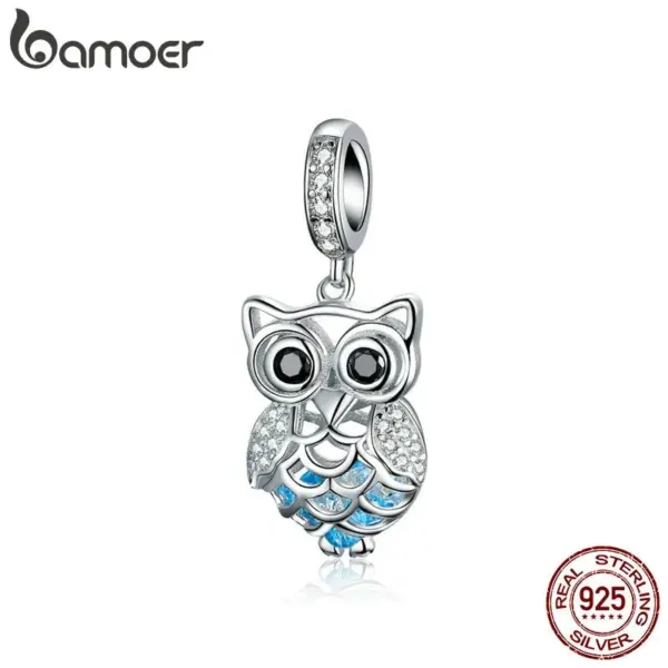 82806e592105faf4c00cdefd Pingente Coruja Azul