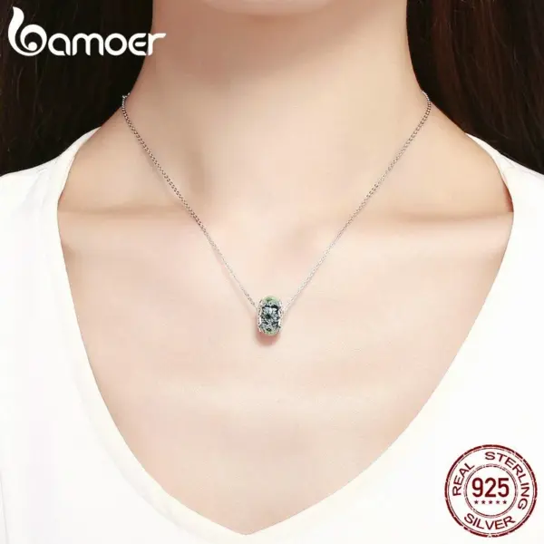 9042b7e40c768c4b2b71796d Berloque Crisântemo Ciano