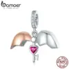 be05c795f2b74cf91422905e Berloque com Argola A chave do coração
