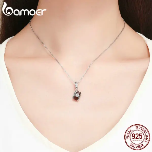 d095d644fd4c212b6e517507 Pingente Câmera