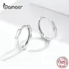 f6df1ea57ba56bb63f053e54 Brincos de Argola Geométrica