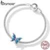 f83a03a120b7a90e8284d6f6 Pingente Borboleta Azul