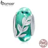 fa2ee446fffa3ad28455d7ec Berloque Folhas do Verão